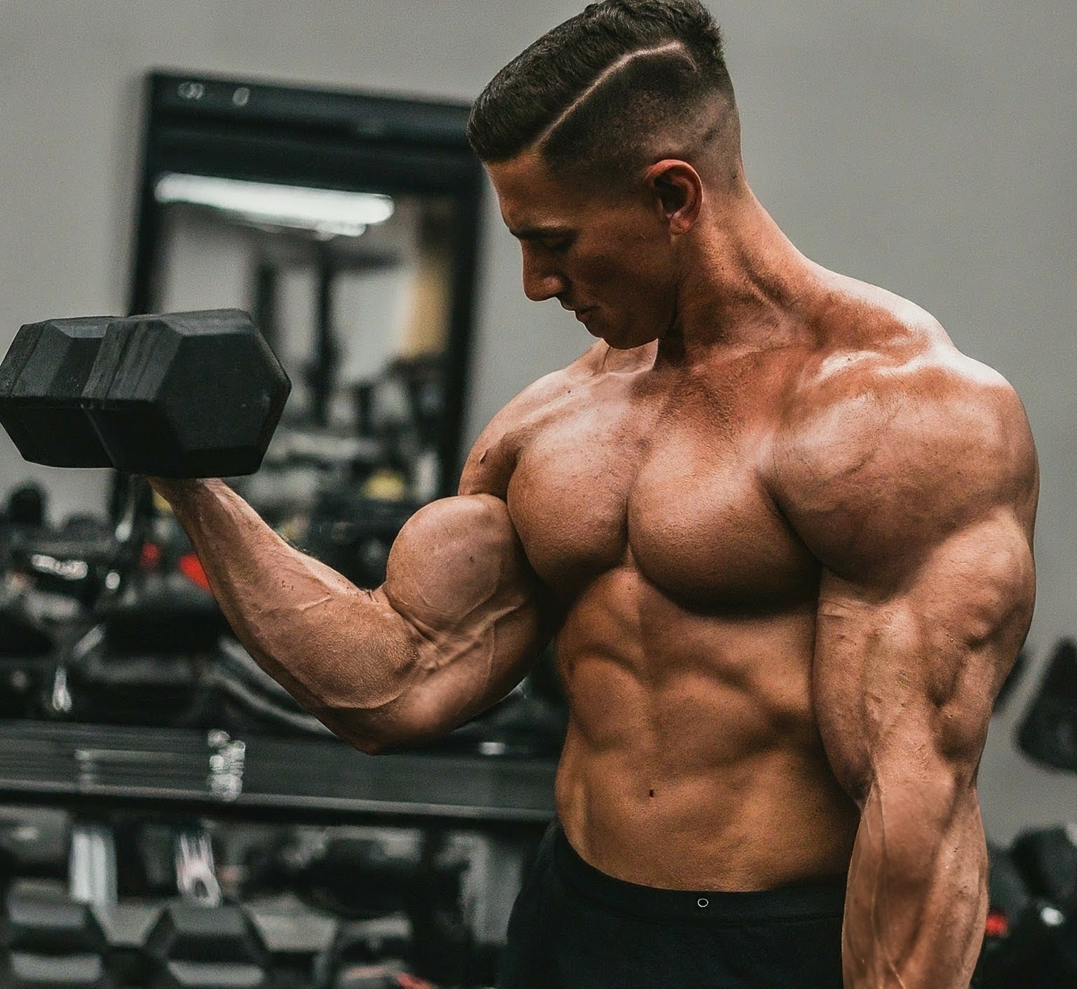 a man is doing strength training at the gym